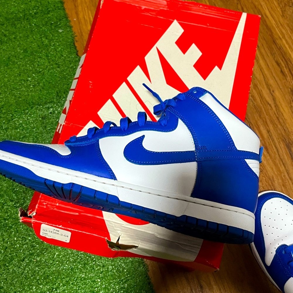 Royal Blue high-top dunks.